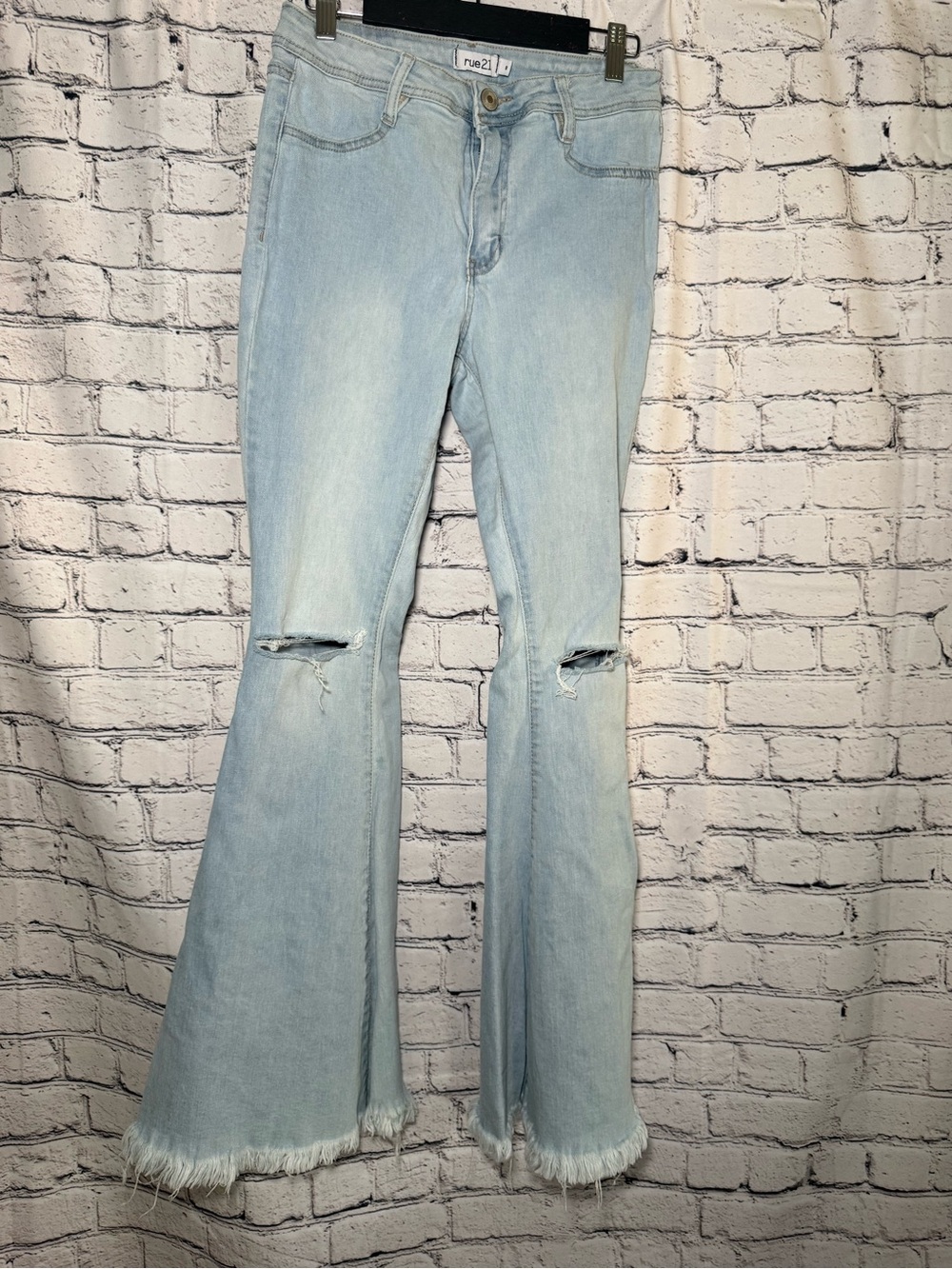 Rue21. Light denim frayed flare jeans. Size 8
